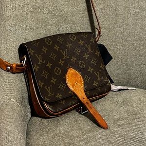 True vintage adjustable leather shoulder strap. Monogram Canvas Cartouchiere PM